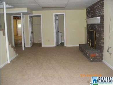 DEN WITH FIREPLACE DOWN STAIRS