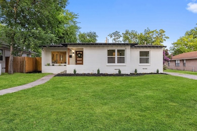 View of front of home featuring brick siding