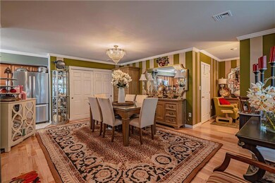Formal Dining Room with maple hardwood flooring