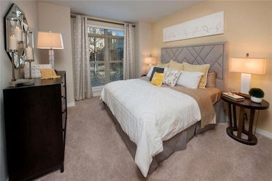 Bedroom with light carpet