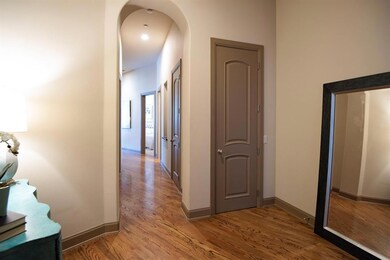 Beautiful wood flooring throughout the entry, hall
