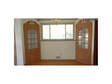 Dining room with hardwood floors and built in hutc