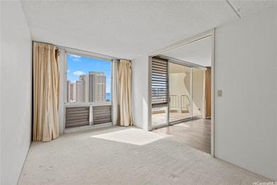 The primary bedroom features bright natural light and a sliding partition to the living area