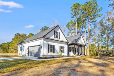 Modern inspired farmhouse featuring a porch and a 