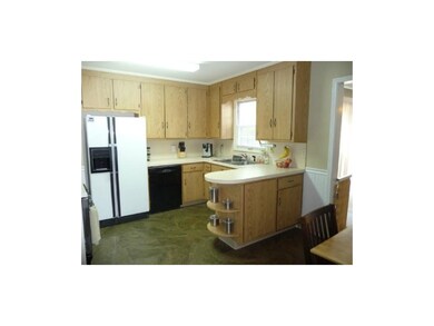 Plenty of storage and counters in kitchen with a d