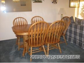 Table has 2 leaves  8 chairs