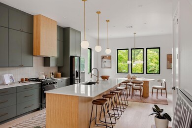 Kitchen with gas stove, stainless steel fridge, l