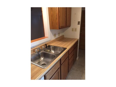 Newer Kitchen and Cabinets. Overlooks a back room 