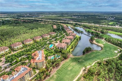 Birds eye view of property with a water & golf course view