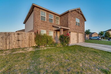 A floor plan that has the living room overflowing into the kitchen space.