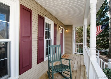 The front porch is inviting with handsome columns,