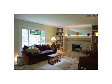 Living Room with stacked stone hearth, custom buil