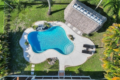 Newly resurfaced pool, tiki hut with composite dec