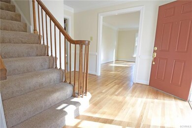 Elegant entrance foyer features new hardwood floor