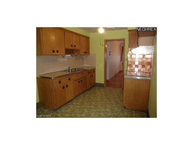 Kitchen is freshly painted with plenty of natural 