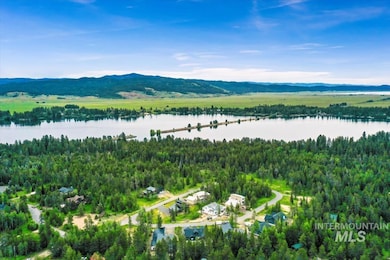 Bird's eye view of a water and mountain view and a heavily wooded area
