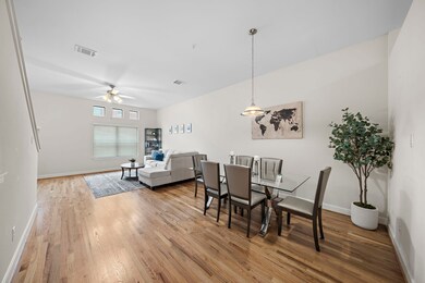 Hardwood floors span this open-concept townhome. F