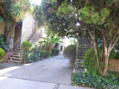 Front of the 12 unit apartments.   Six units on each side.  Three units upstairs, 3 units downstairs in each building, total of 12 units.   Driveway goes to parking area behind the units.