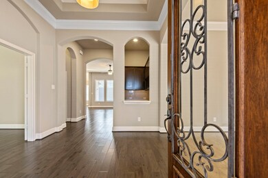Stunning wood floors throughout - NO CARPET! Beautiful architectural details, tall tray ceilings, crown molding.