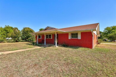 Single story home with a front yard