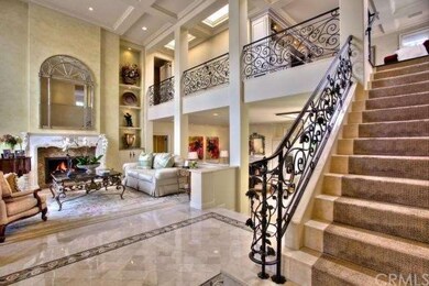 Living room foyer with grand staircase