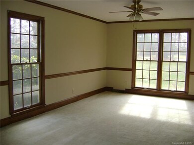 Family room runs length of house with windows on f