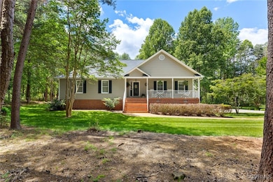 View of front of home with covered porch and a fro