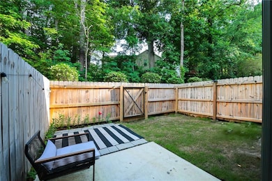 Fenced backyard featuring a patio