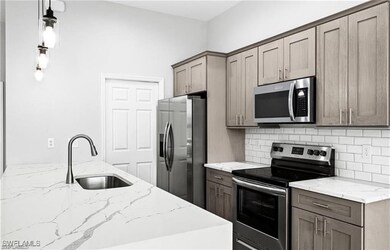 Kitchen featuring appliances with stainless steel