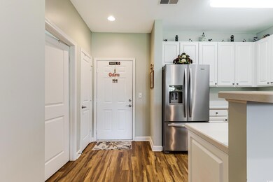 Kitchen featuring stainless steel fridge with ice 