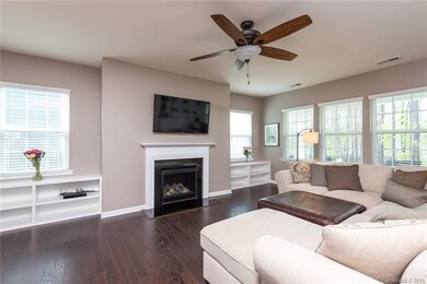 Great room with hardwood floors, built in shelving