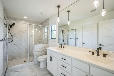 Full bathroom featuring marble look tile flooring