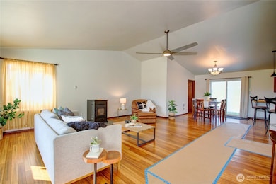 Lovely open concept, cozy pellet stove, formal dining room, vaulted ceilings and kitchen adjoining.