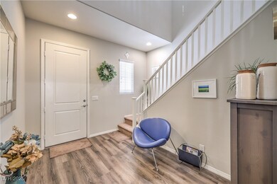 Foyer with recessed lighting, wood finished floors