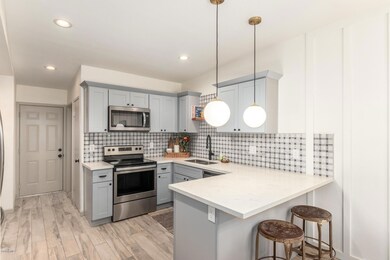 Updated cabinets with quartz countertops