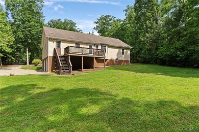 large deck overlooking spacious open back yard.