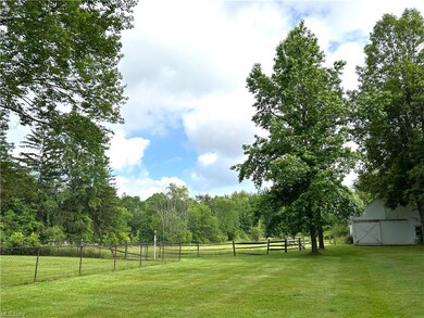 Barn with pastures and fenced in area