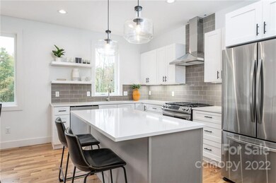 Chef's Kitchen Features Quartz, Stainless Steel and a Large Island