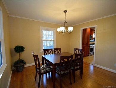Formal Dining room boasts hardwood floors and crow