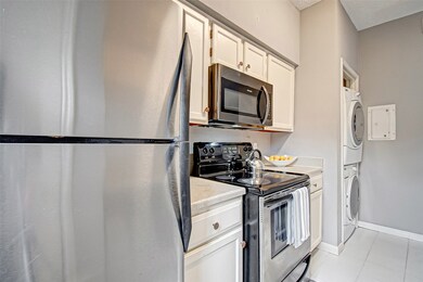 Kitchen is equipped with refrigerator, microwave,