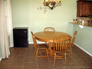 Dining area open to living room and kitchen.