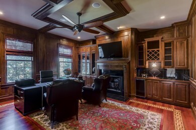 Library with fireplace, wet bar and coffered ceiling