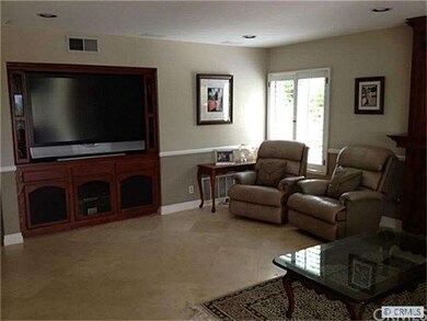 Family room features flush lighting, travertine fl