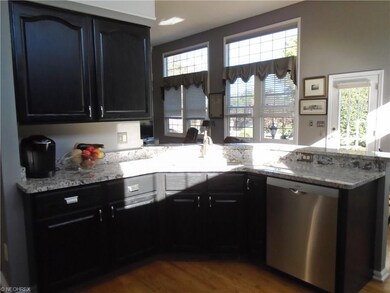 Sink views into great room- keep the cook with the