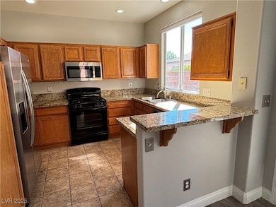 Kitchen featuring appliances with stainless steel