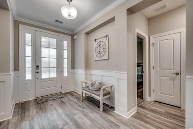 Doorway to outside featuring light hardwood / wood