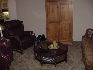 Living room large enough for several seating areas