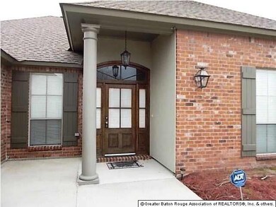 Freshing stained front door and owner is planting 