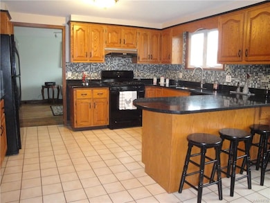 Gleaming Quartz Countertops are Featured in the Ki