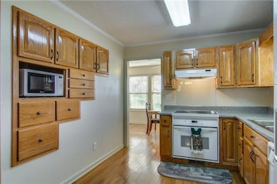Kitchen - No wasted space!!  Built-in for your microwave and extra cabinets!
